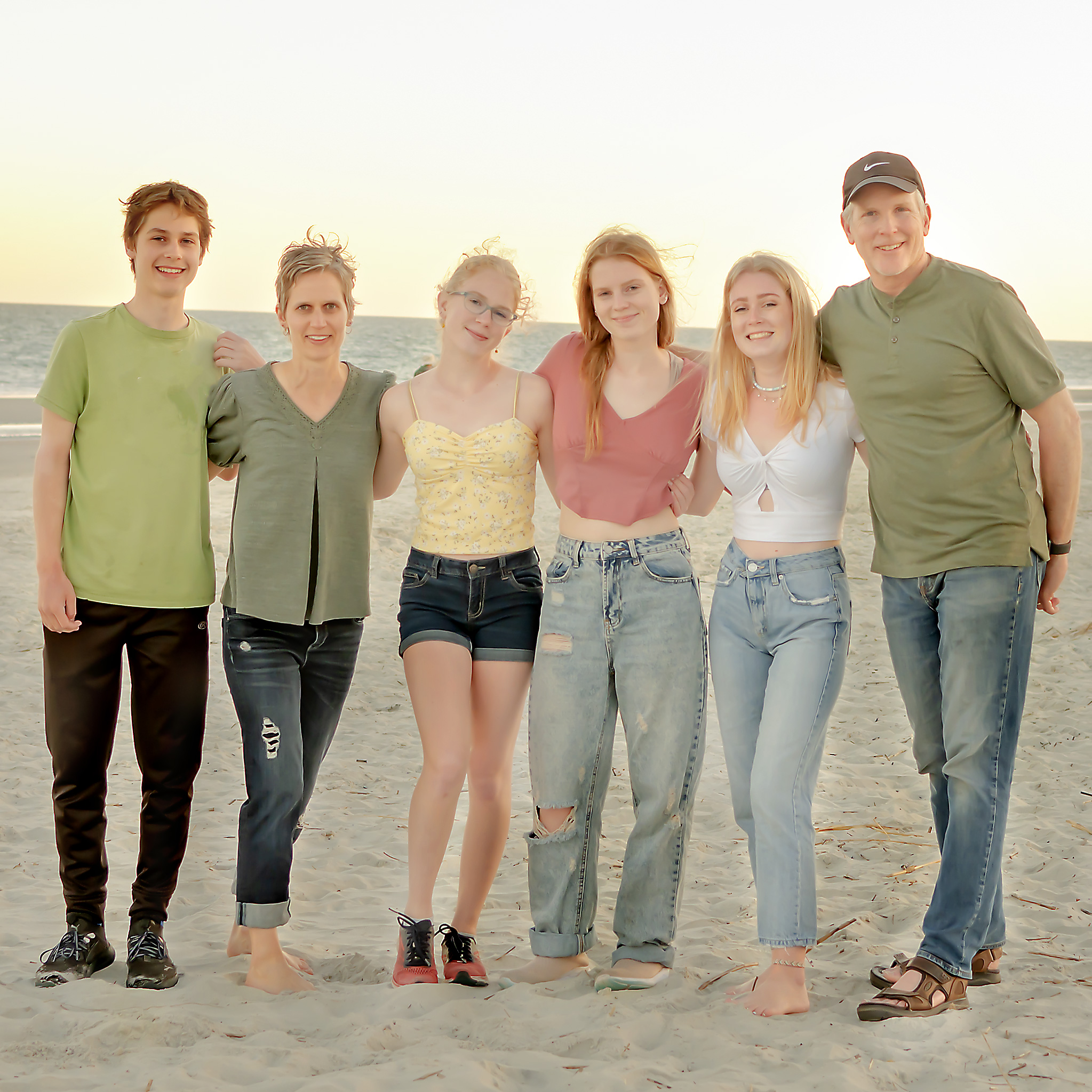 Michelle DenBak, Niagara family photographer, standing with  her family on vacation