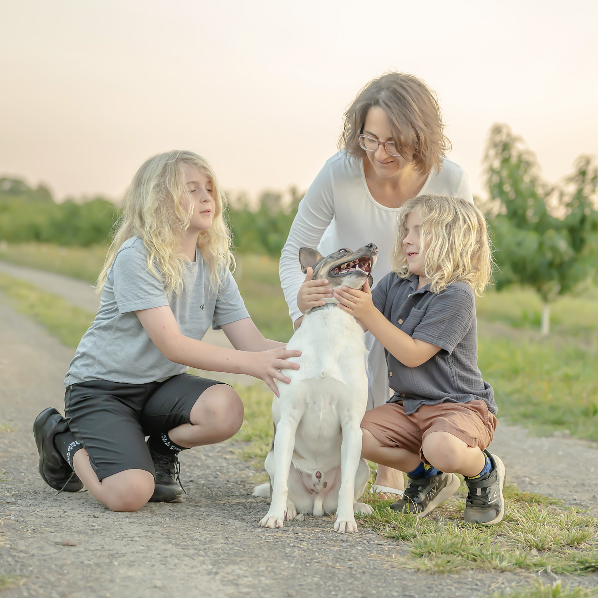Outdoor candid family photography session with family pet
