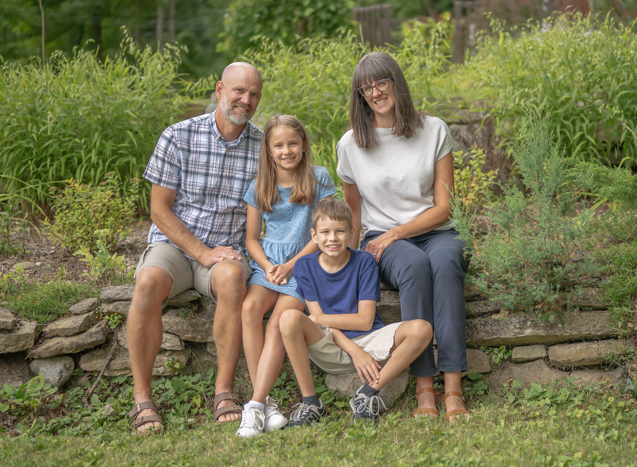 Professional family photo of family of four in their home in Lincoln