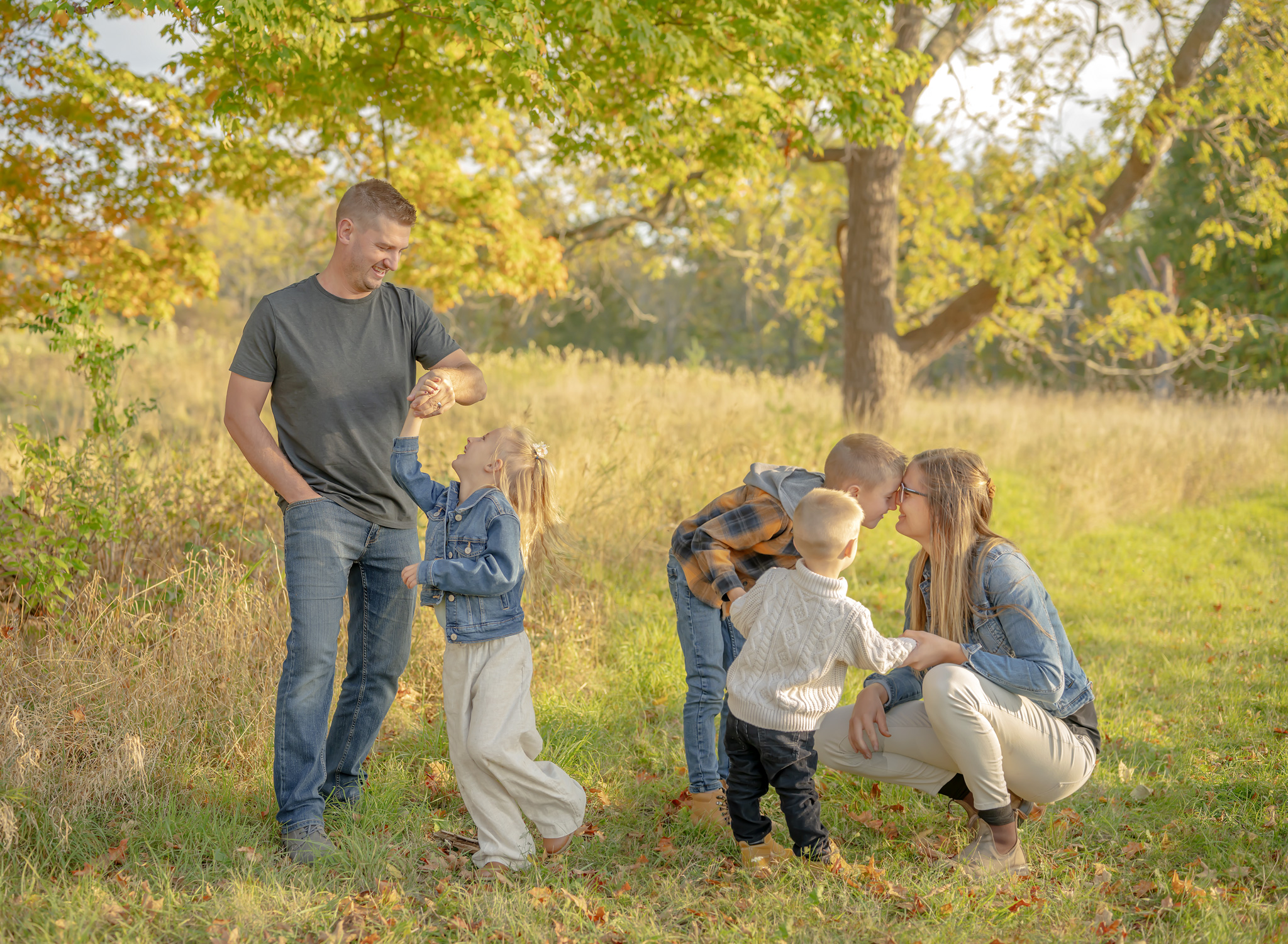 Lifestyle family session outdoors at a park in Lincoln, Ontario featuring a family with three kids.