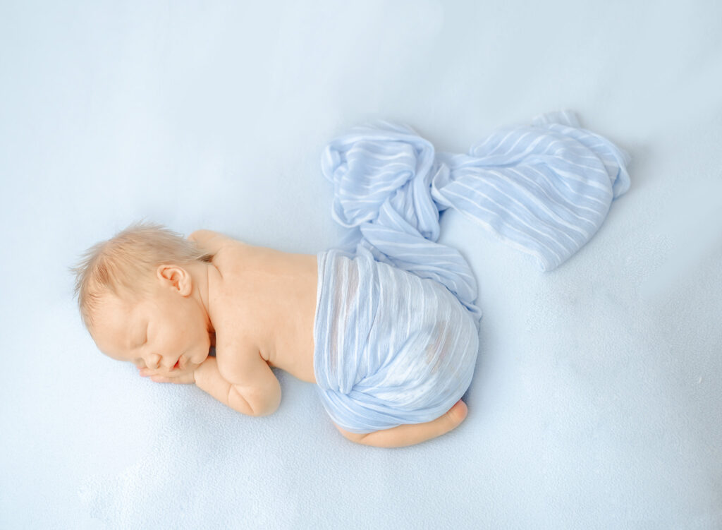 Soft neutral newborn photography with natural textures