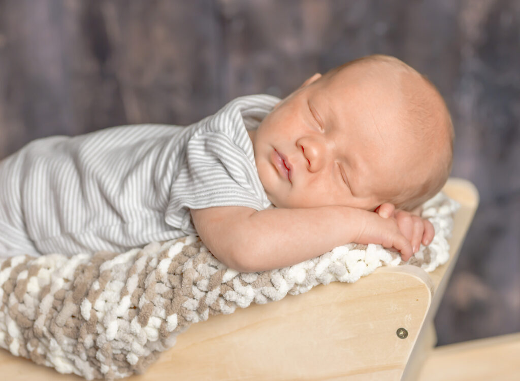Peaceful newborn portrait taken in St. Catharines, Ontario photography studio.